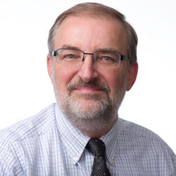 Man with tie, beard and glasses