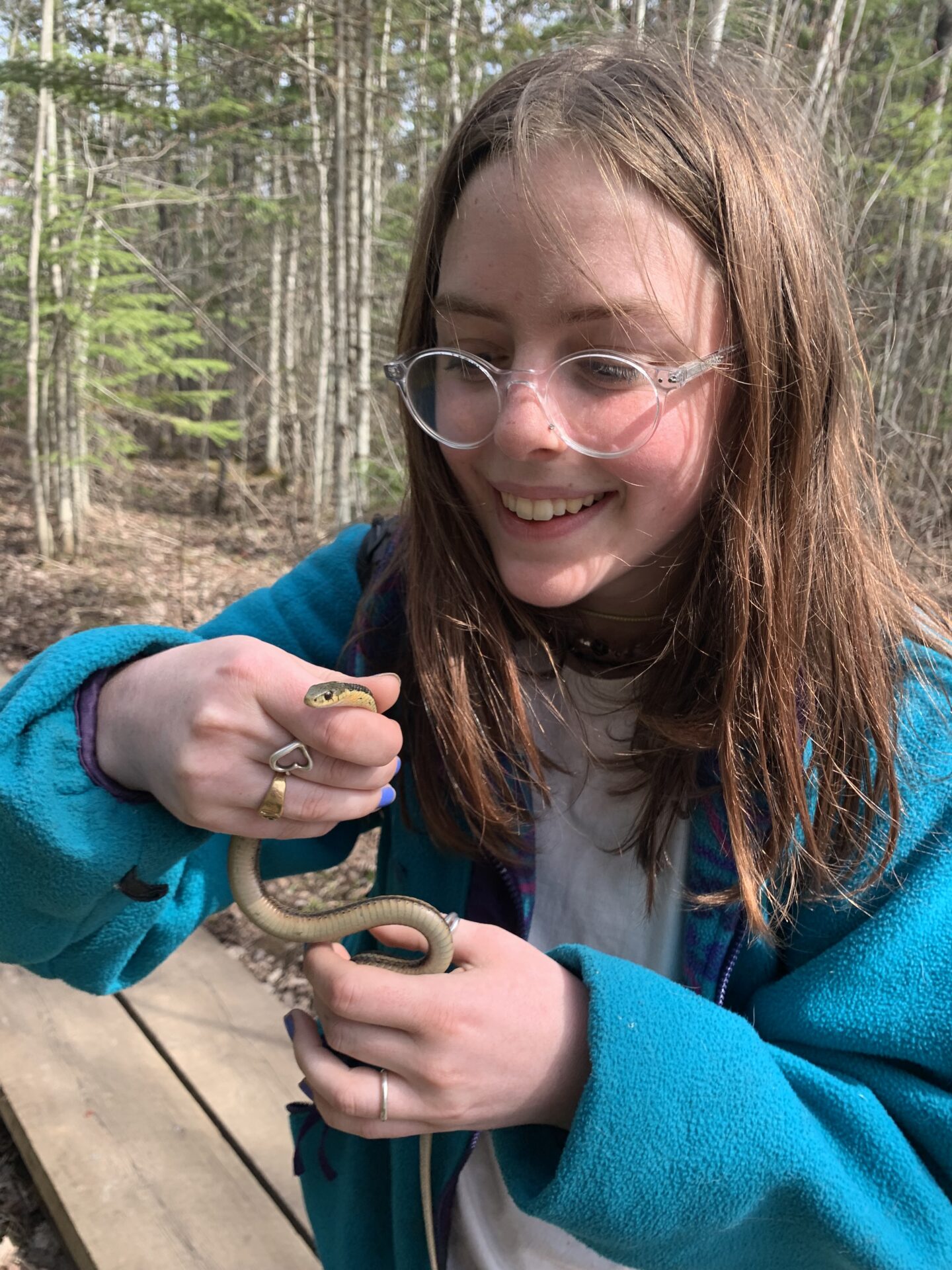 Lucia Richardson holds up a snake.