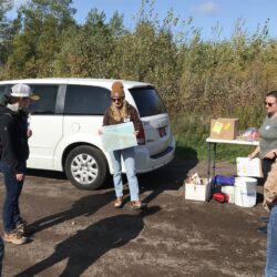 Tiedmann holds us a topographical map and discusses bluff erosion at Schafer Beach in Superior, Wisconsin.