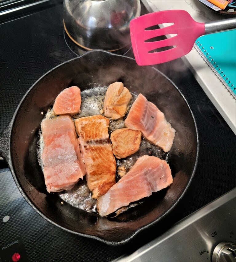 Cooking the salmon. Image credit: Sharon Moen, Wisconsin Sea Grant