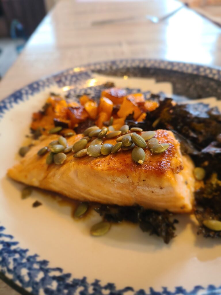 Crispy salmon with roasted squash and kale chips. Image credit: Marie Zhuikov, Wisconsin Sea Grant
