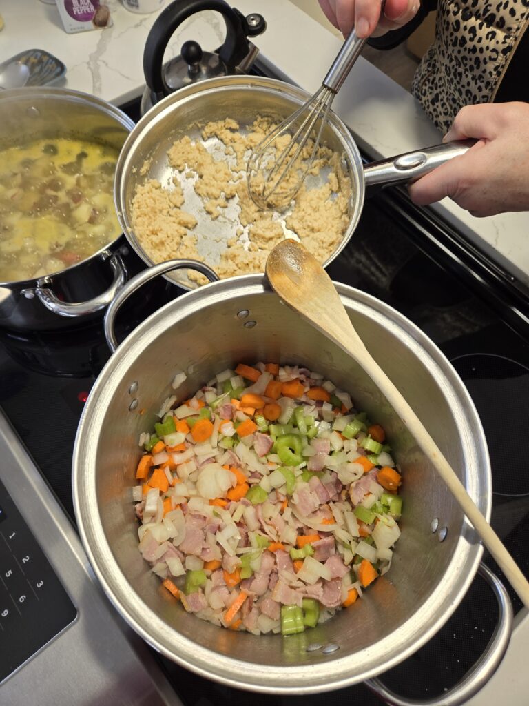 Cooking the chowder requires several pans going at once on the stove. Image credit: Marie Zhuikov, Wisconsin Sea Grant